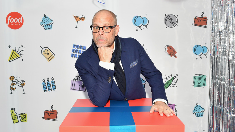 Alton Brown with fist under chin