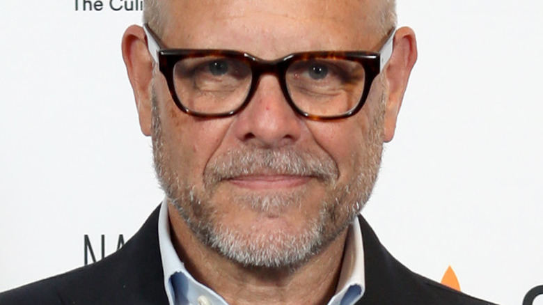 Alton Brown smiling in glasses