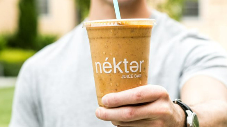 Nekter smoothie in hand