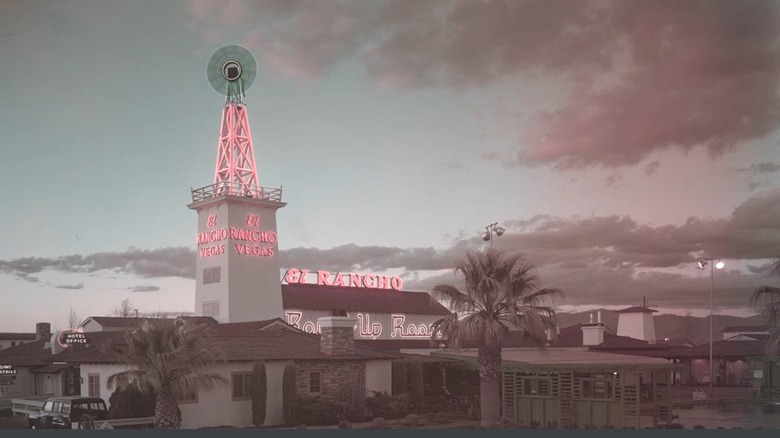 The El Rancho Vegas casino at dusk in the 1950s, with red neon lights