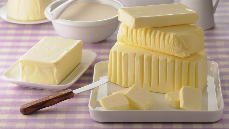 Softened butter on white platters