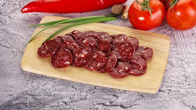 Wild bear meat cut up on a wooden cutting board