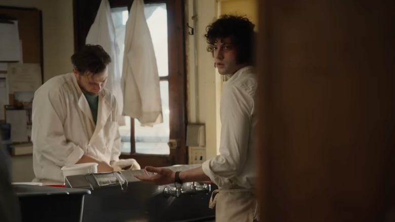 Dominic Sessa as Tony working in a kitchen with Leo Woodall