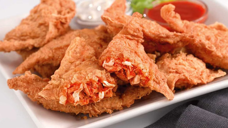 Cheesecake Factory Buffalo Blasts on a white plate with sauces