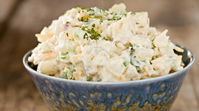 Creamy potato salad in ceramic bowl
