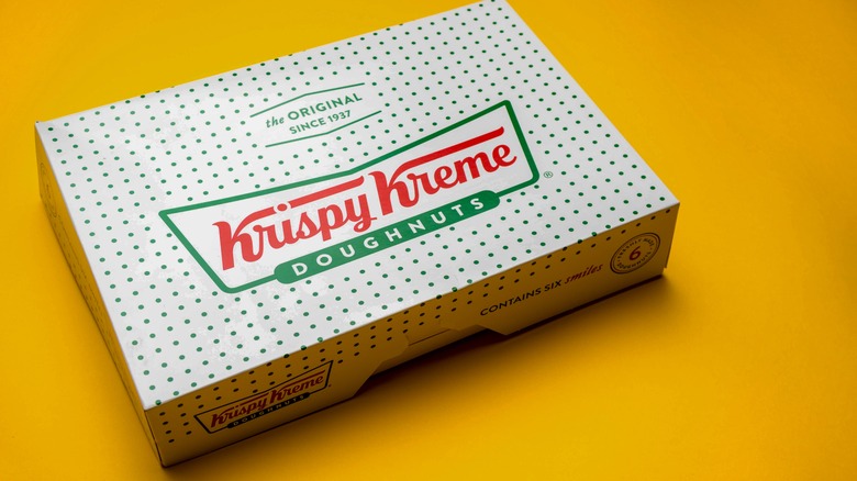 Krispy Kreme box on yellow background