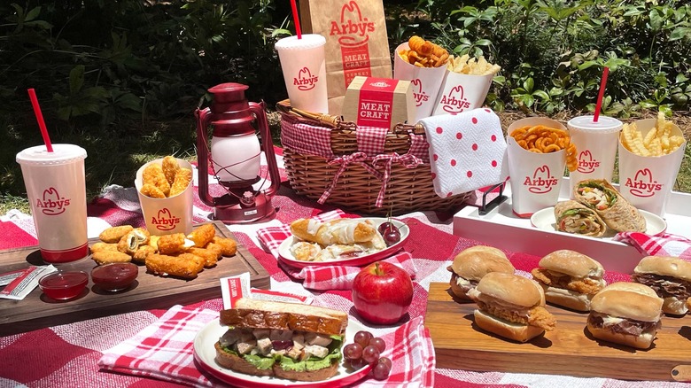 Picnic set up with a variety of Arby's foods