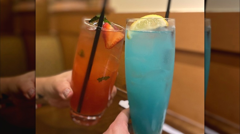 two cocktails cheers-ing 