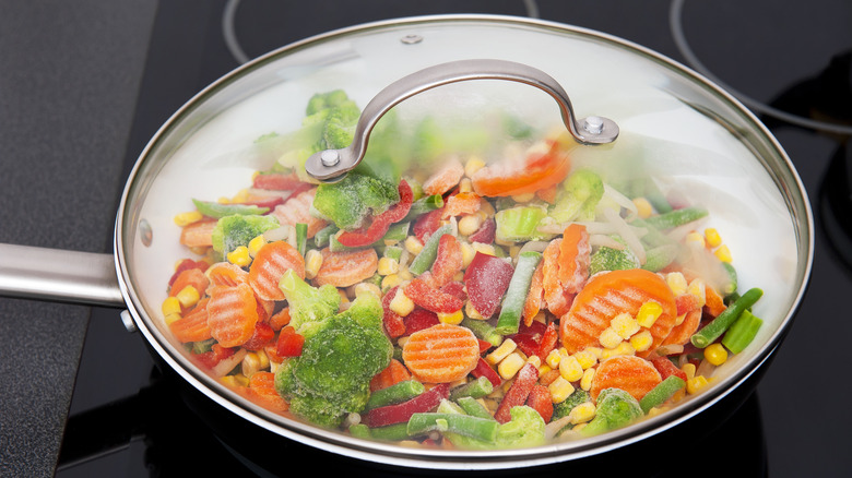 frozen vegetables cooking in pan