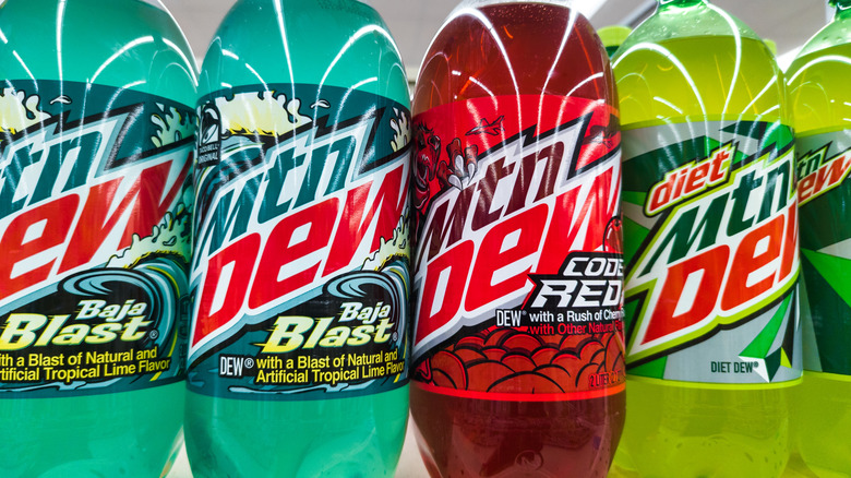 Bottles of Mountain Dew flavors on store shelf
