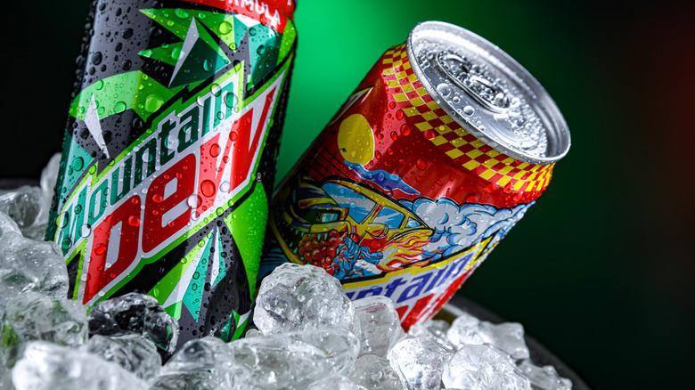 Two varieties of canned Mountain Dew on ice