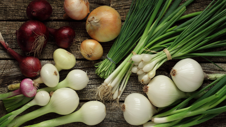 Different kinds of onions laying together