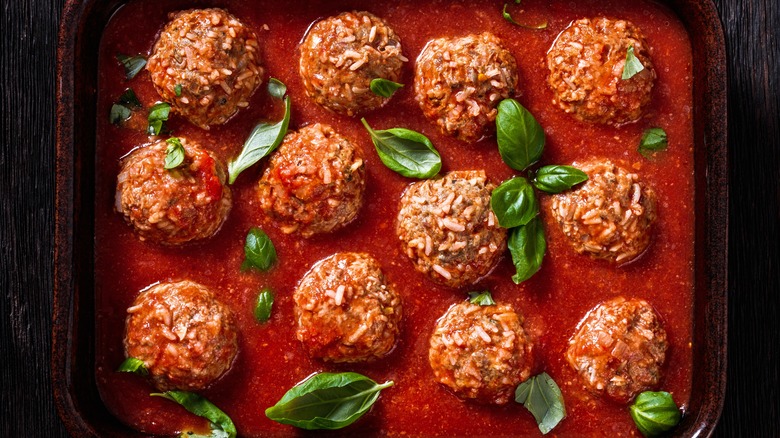 Porcupine meatballs in tomato sauce in an oven pan
