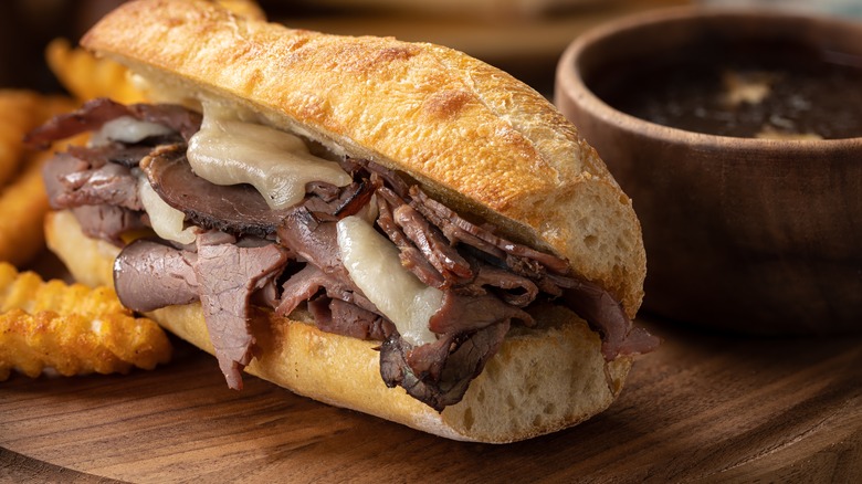 french dip sandwich served with fries and au jus