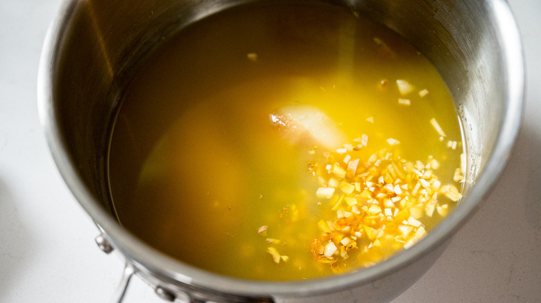orange sauce in saucepan