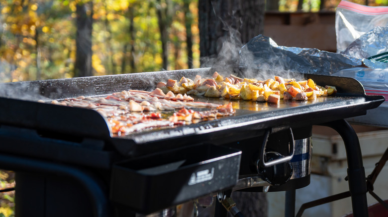 Bacon and potatoes on griddle