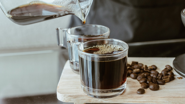 Coffee pouring into glass cups