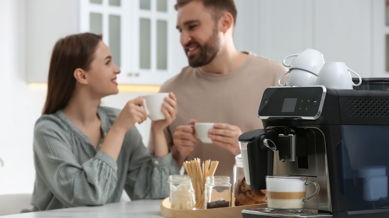 Couple enjoying cups of coffee