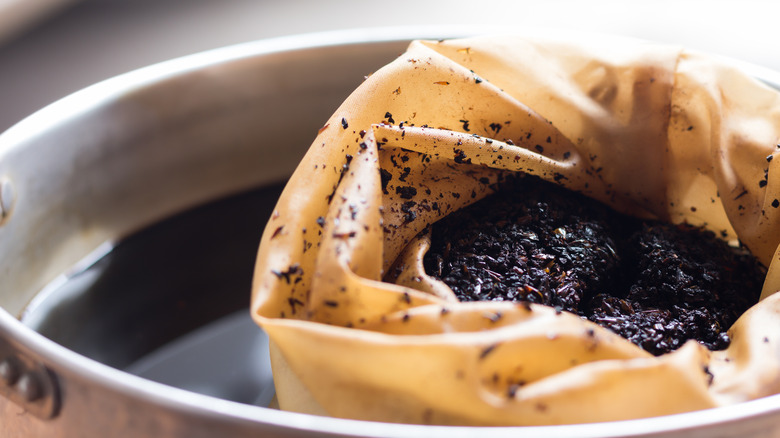 Coffee grounds steeping in water