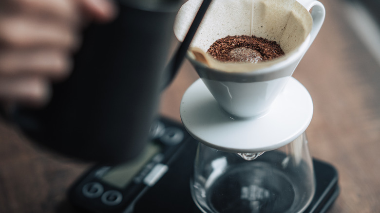 Water pouring over coffee grounds