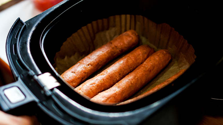Hot dogs in an air fryer basket