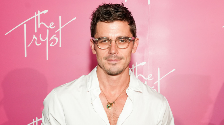 Antoni Porowski in glasses and white shirt