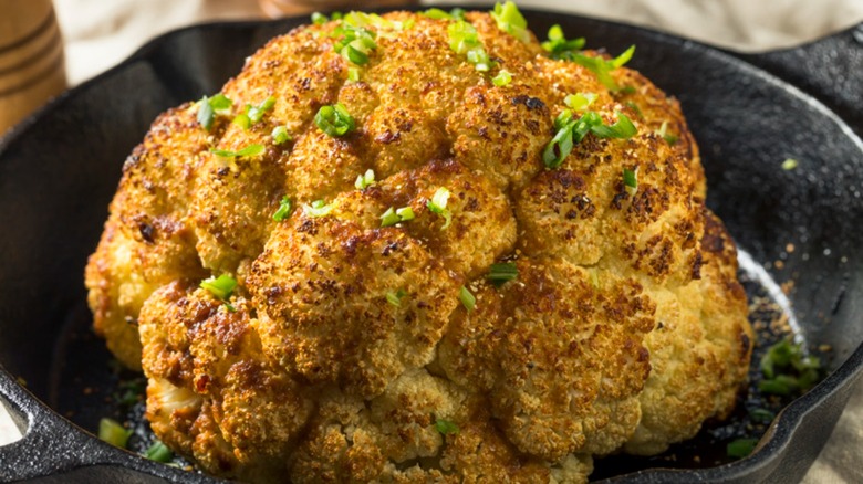 baked whole cauliflower in skillet
