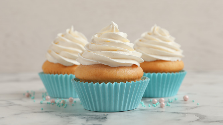 cupcakes topped with white frosting