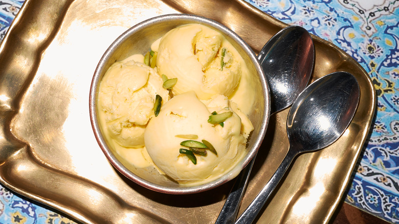 Bowl of bastani on gold tray