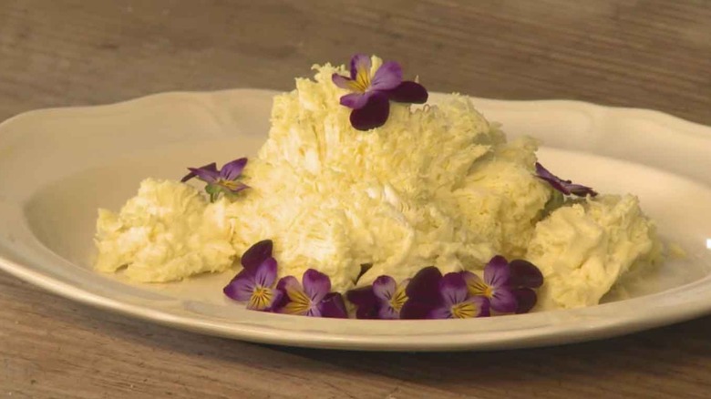 Fairy butter on plate with purple flowers