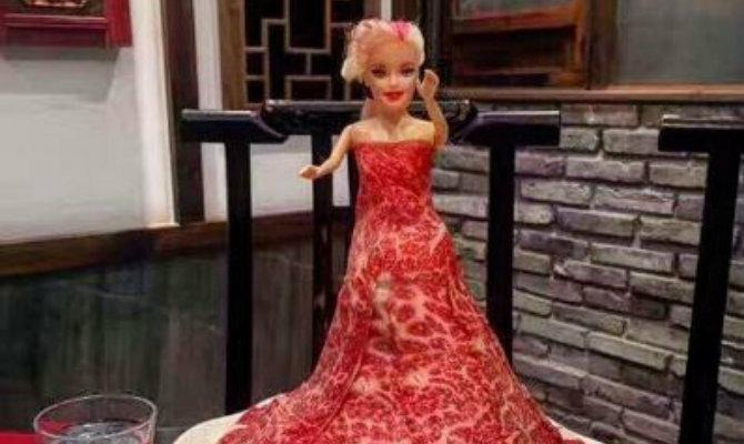 doll wearing a meat dress