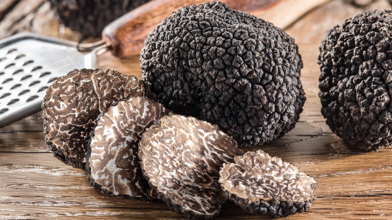 black winter truffles on table