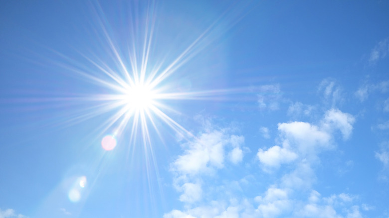 Sun shining on blue sky