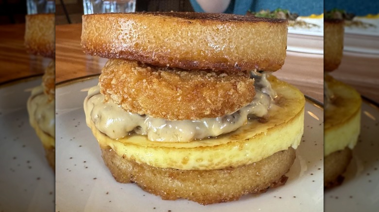 vigan longganisa, egg, cheese, and hashbrown on bibingka sandwich