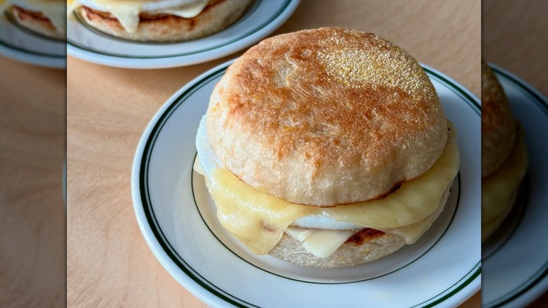 An English muffin sandwich with egg and cheese