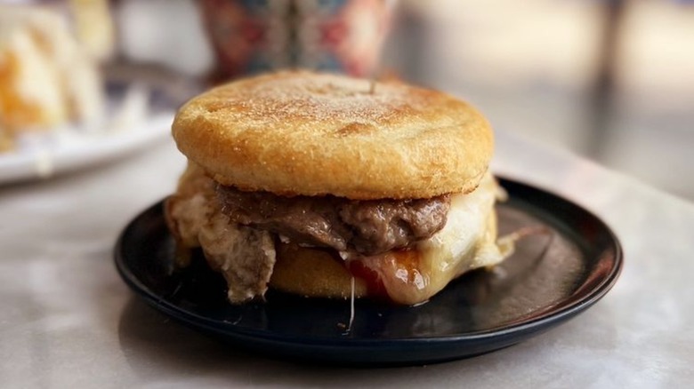 English muffin sandwich with sausage and cheese