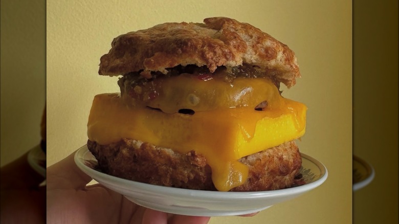 Biscuit sandwich with egg, sausage, and cheese