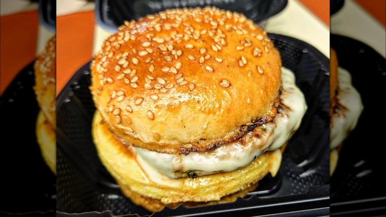Milk bread bun with sesame sandwich with eggs and sausage