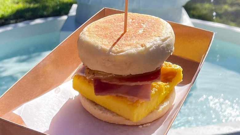 English muffin sandwich with eggs and prosciutto