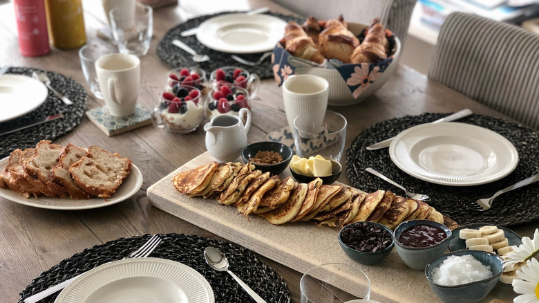 A country table setting with various brunch treats