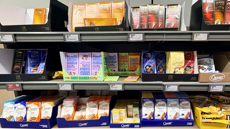 Several chocolate bars stocked on a shelf at an Aldi
