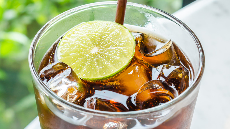 glass of diet coke with lime slice