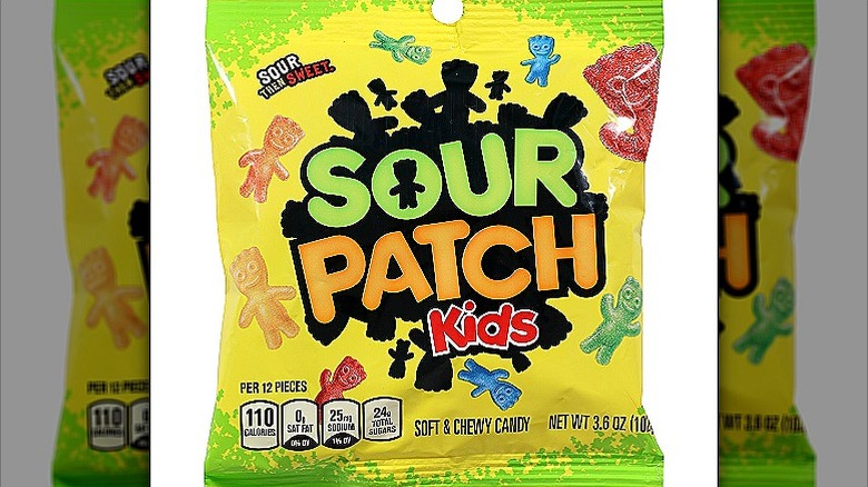 A packet of green and yellow sour patch kids candies
