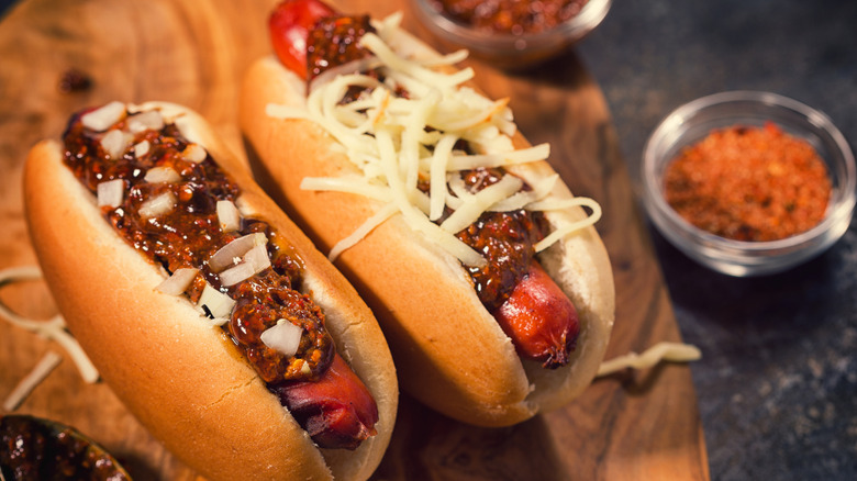 Hot dogs with chili, onions, and cheese