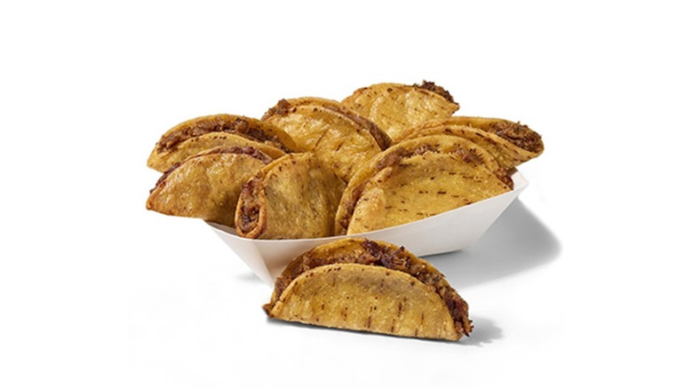 Paper container full of beef mini tacos