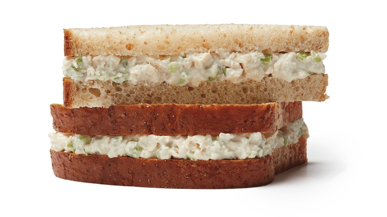 Chicken salad sandwich halves stacked on top of each other
