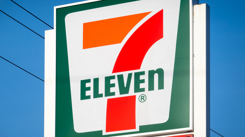 7-Eleven sign against blue sky