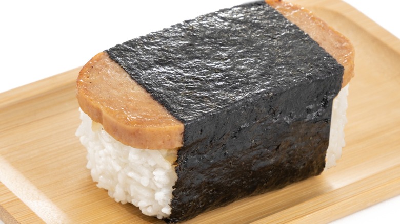 Close-up of spam musubi on wooden dish