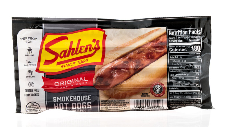 Package of Sahlen's original smokehouse hot dogs on white background
