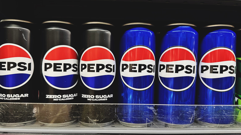Pepsi and Pepsi zero cans on store shelf
